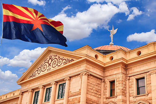 Arizona state capitol building with arizona state flag flying above