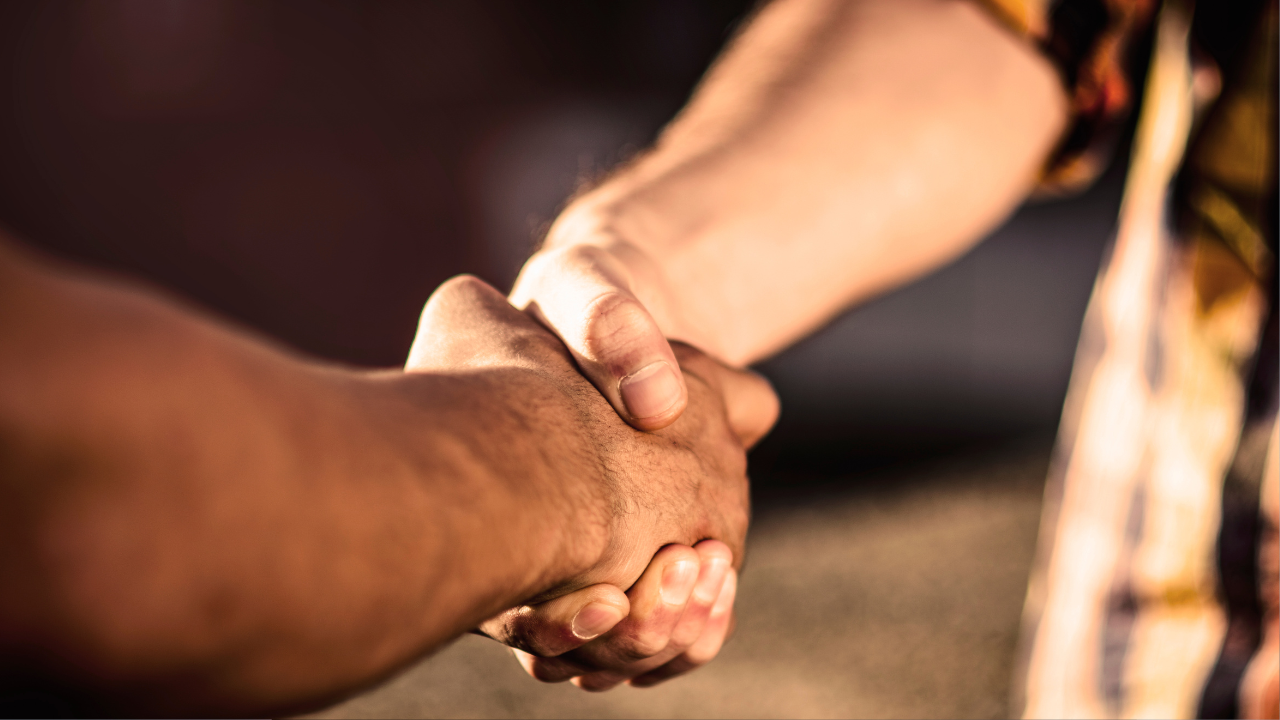 Two people shaking hands.