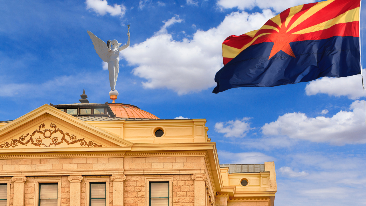 The Arizona State Capitol building and state flag.