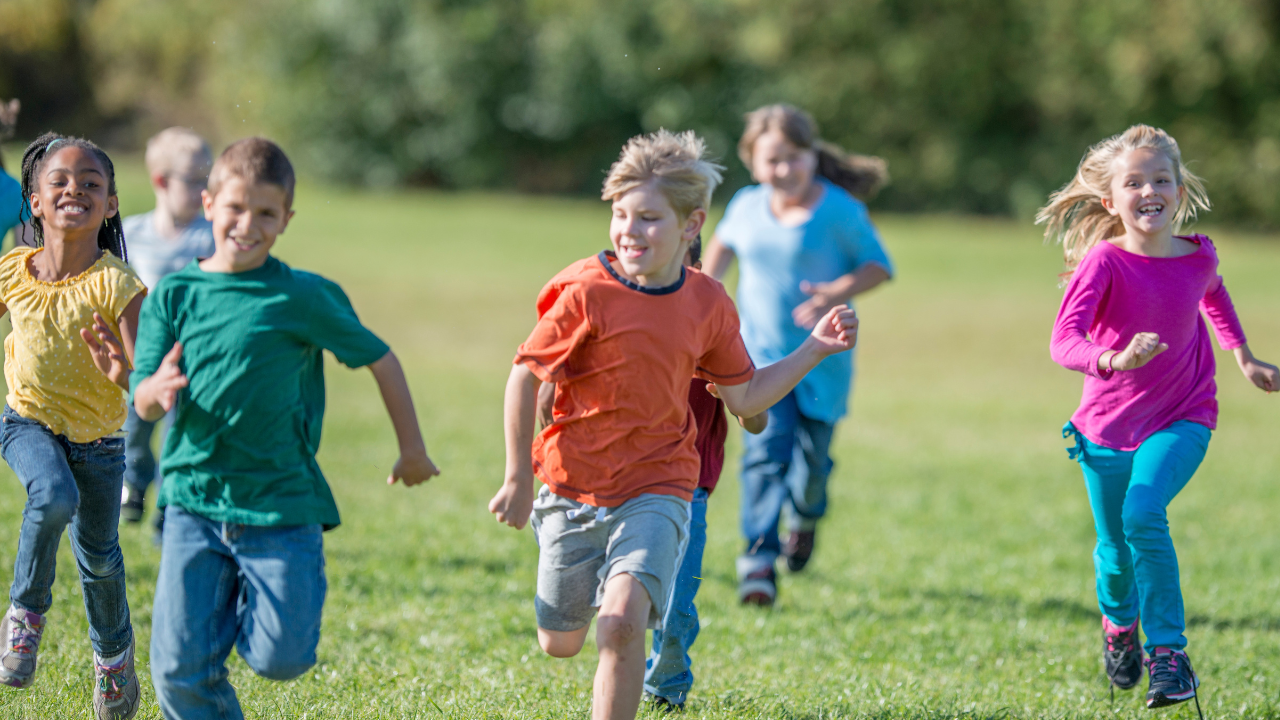 Children running in a field