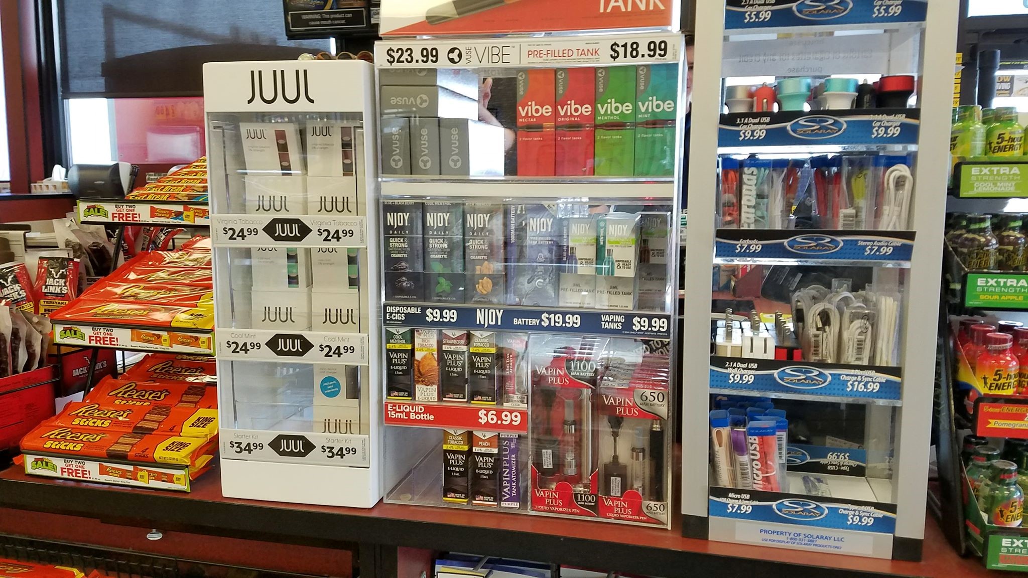 Image of Flavored Tobacco products in a case in a convenience store next to candy